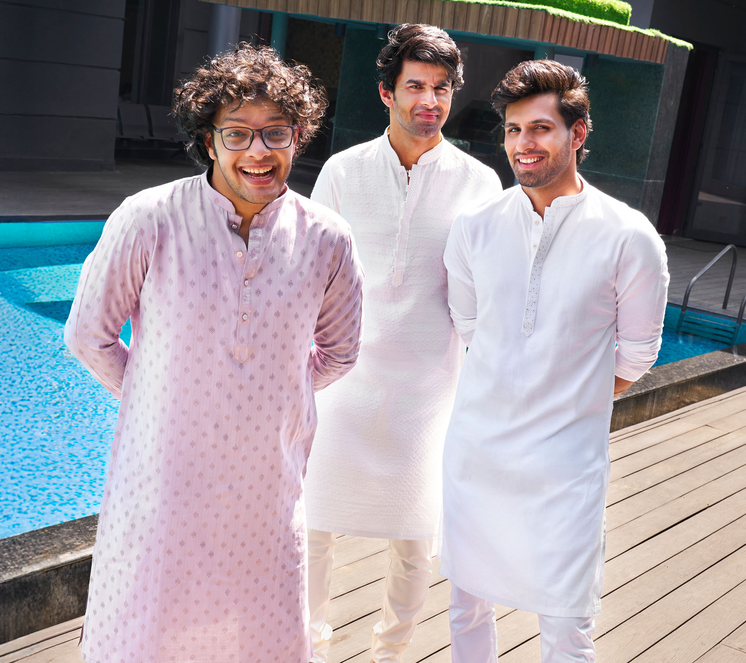 Men wearing classic white kurtas styled for festive celebrations, family gatherings, and traditional occasions